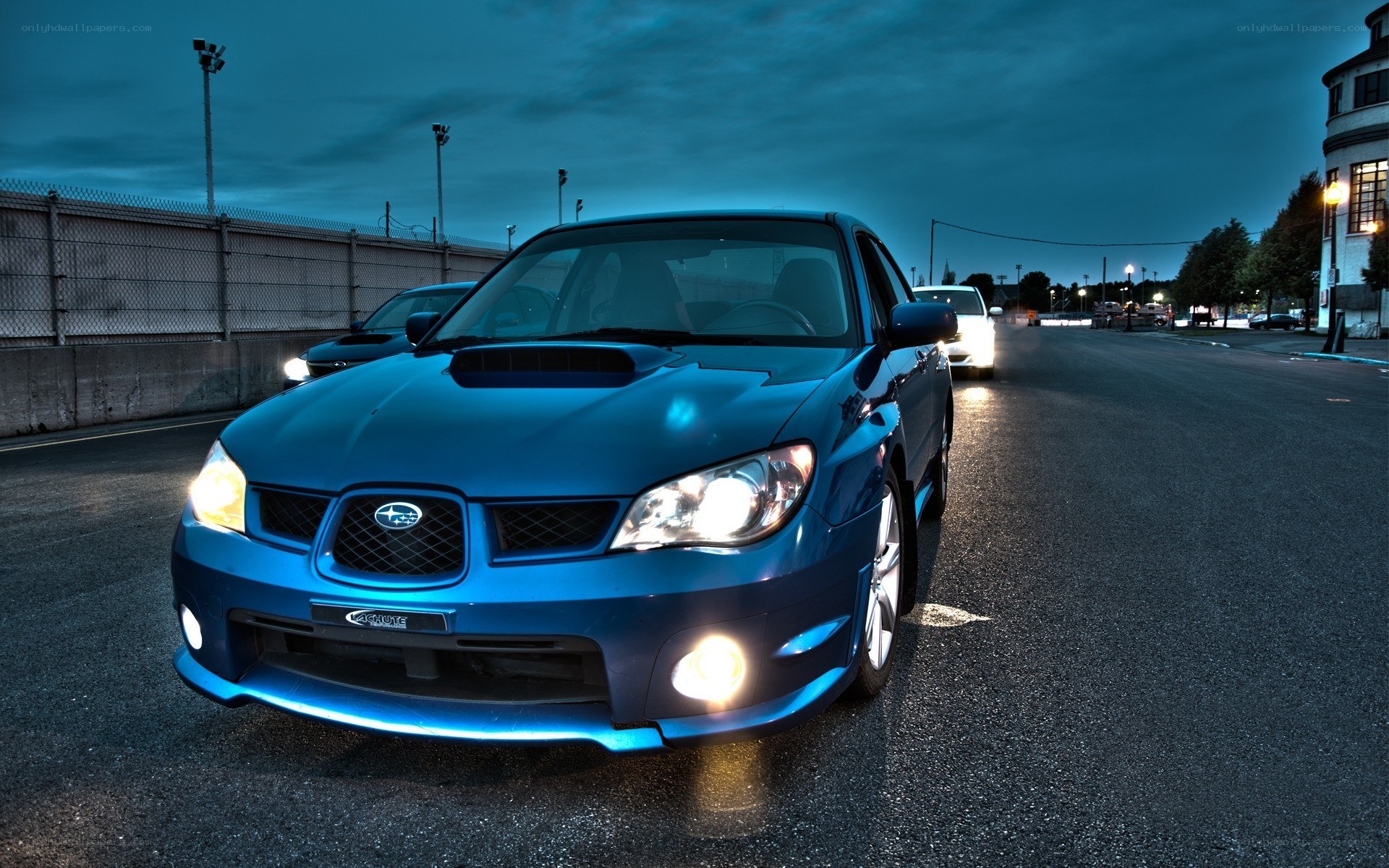 blue subaru on racetrack