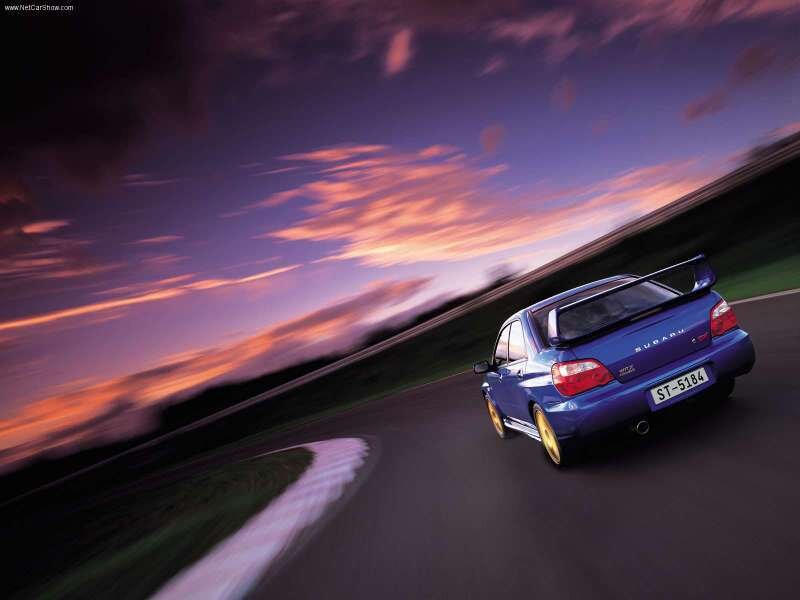 blue subaru on racetrack
