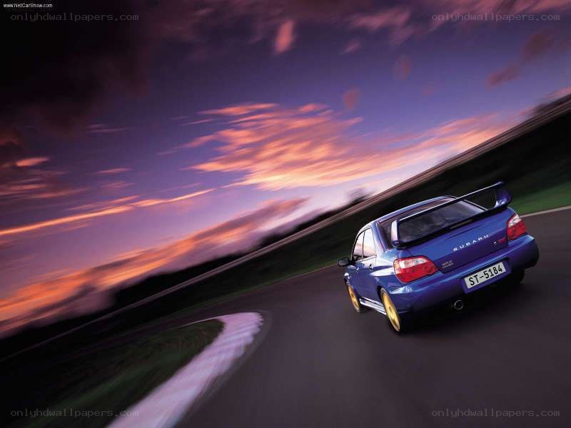 blue subaru on racetrack