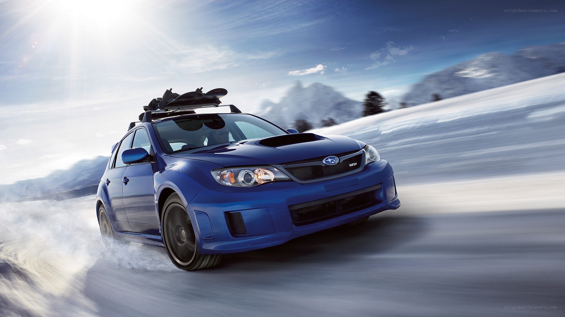 Blue Subaru on snowy road