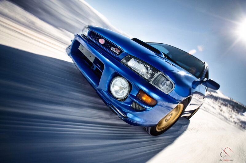 Blue Subaru on snowy road