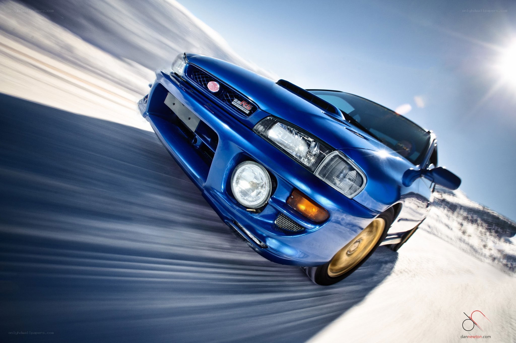 Blue Subaru on snowy road