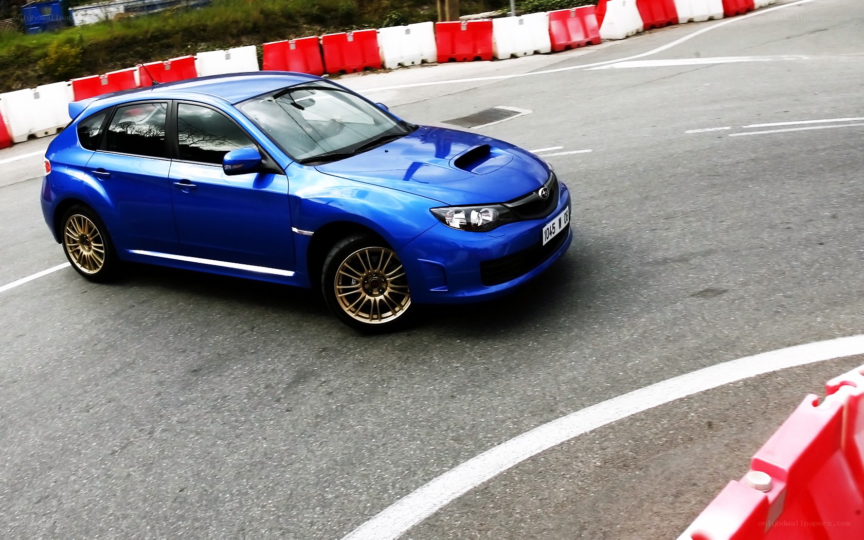 blue subaru on track