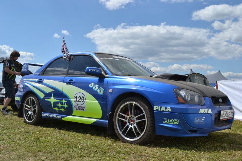 Blue Subaru race car on display