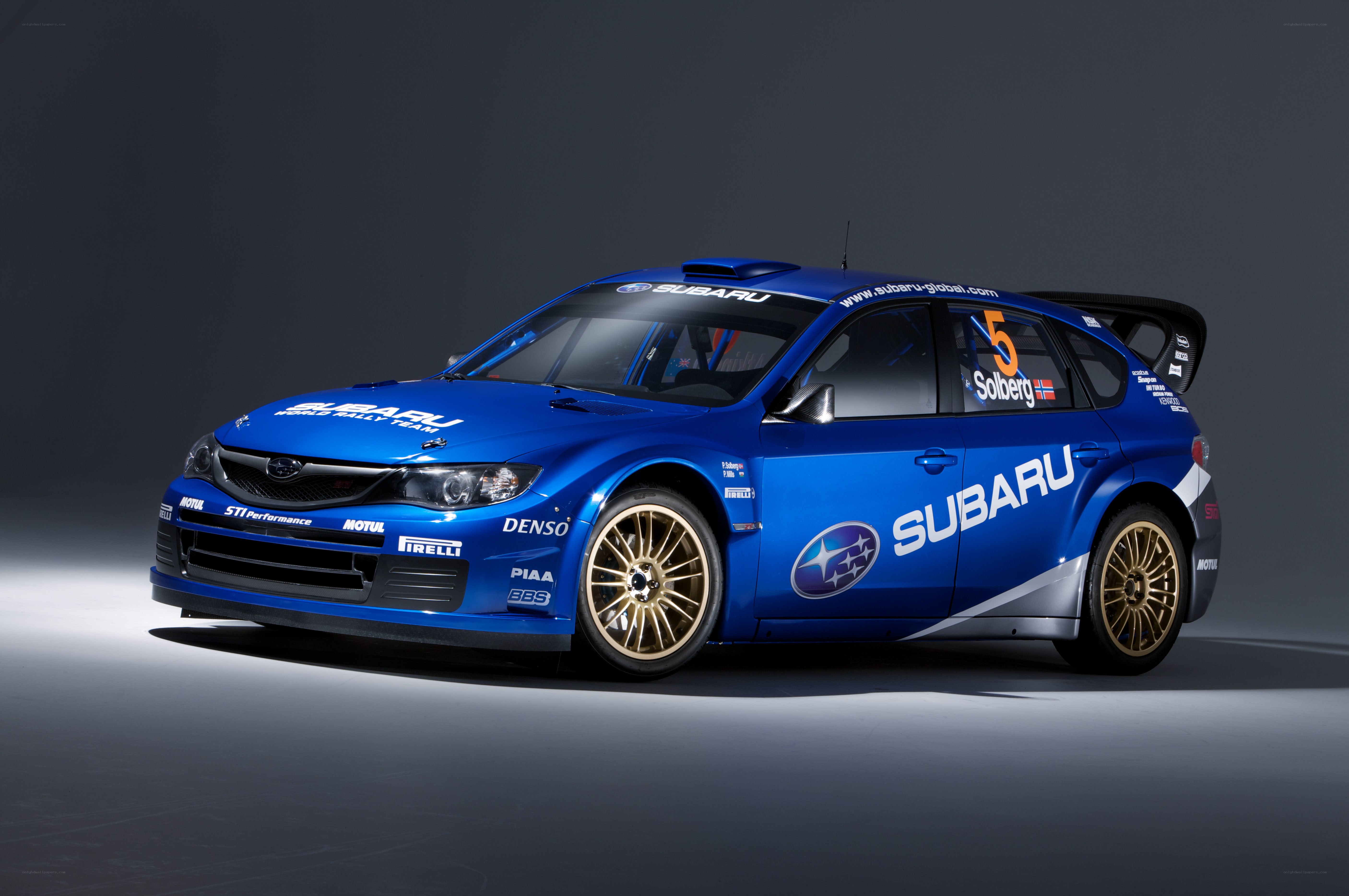 blue subaru rally car