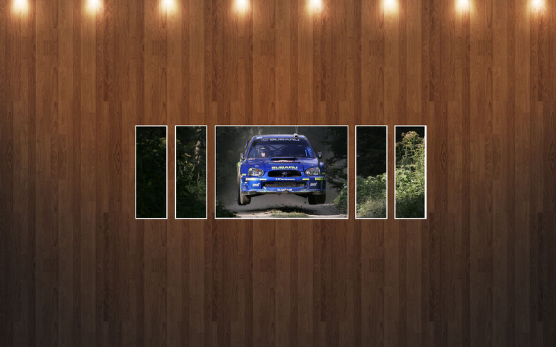 Blue Subaru rally car in action