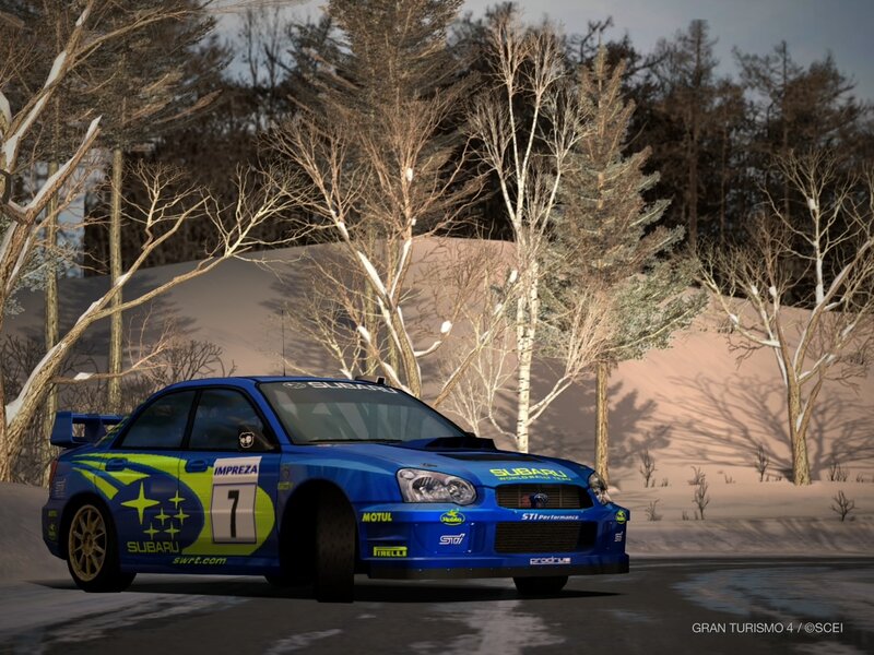 Blue Subaru rally car in snow