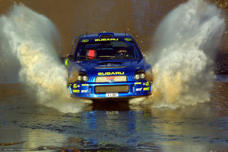 Blue Subaru rally car in water