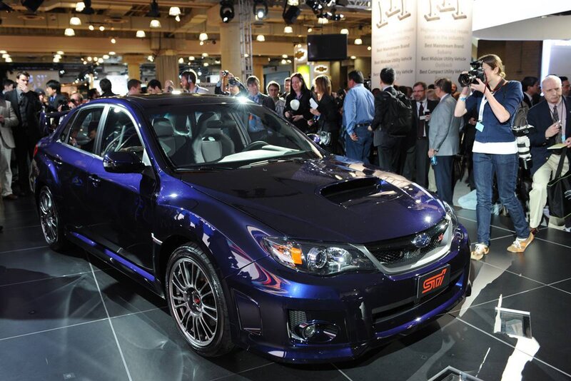 Blue Subaru STI at auto show