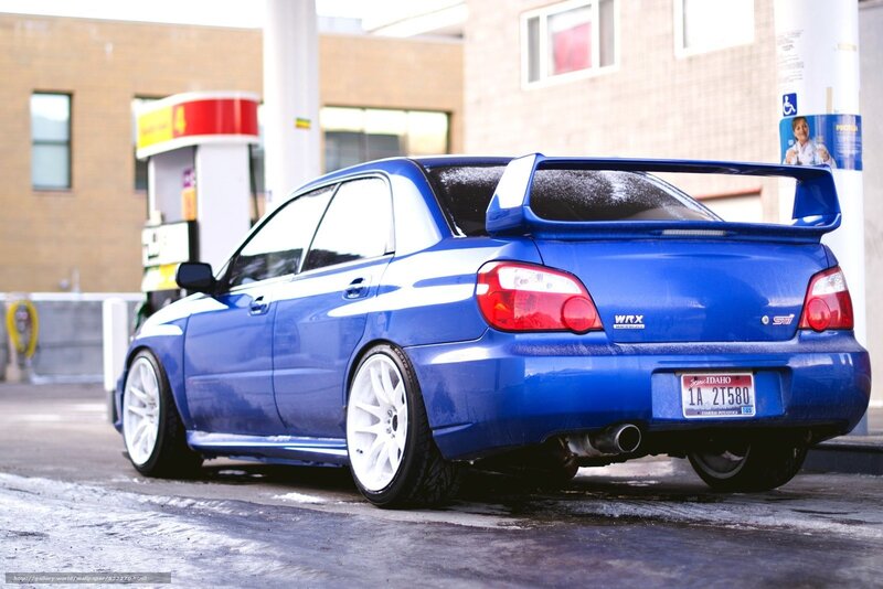 Blue Subaru WRX at gas station