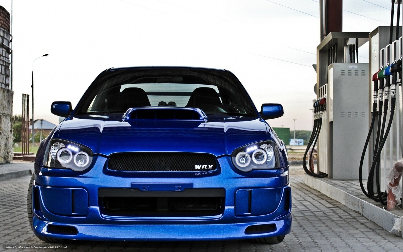blue subaru wrx at gas station