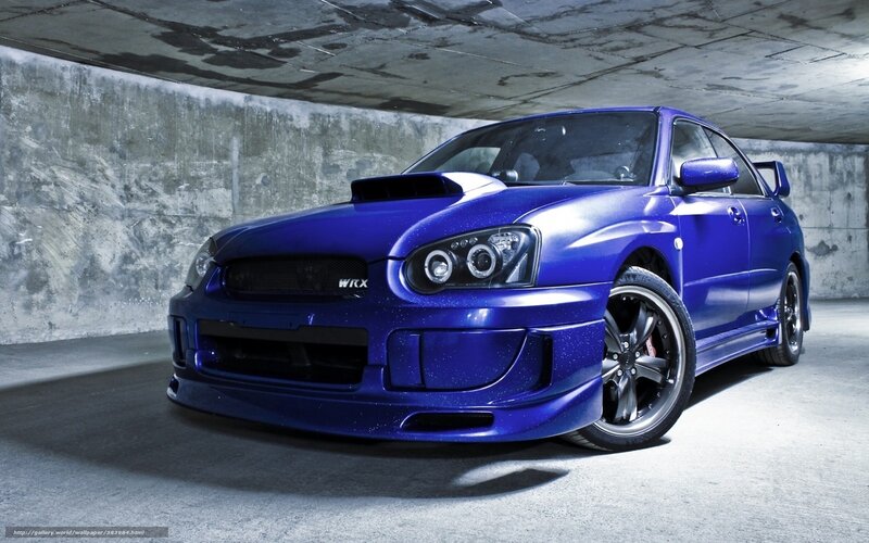 Blue Subaru WRX in garage
