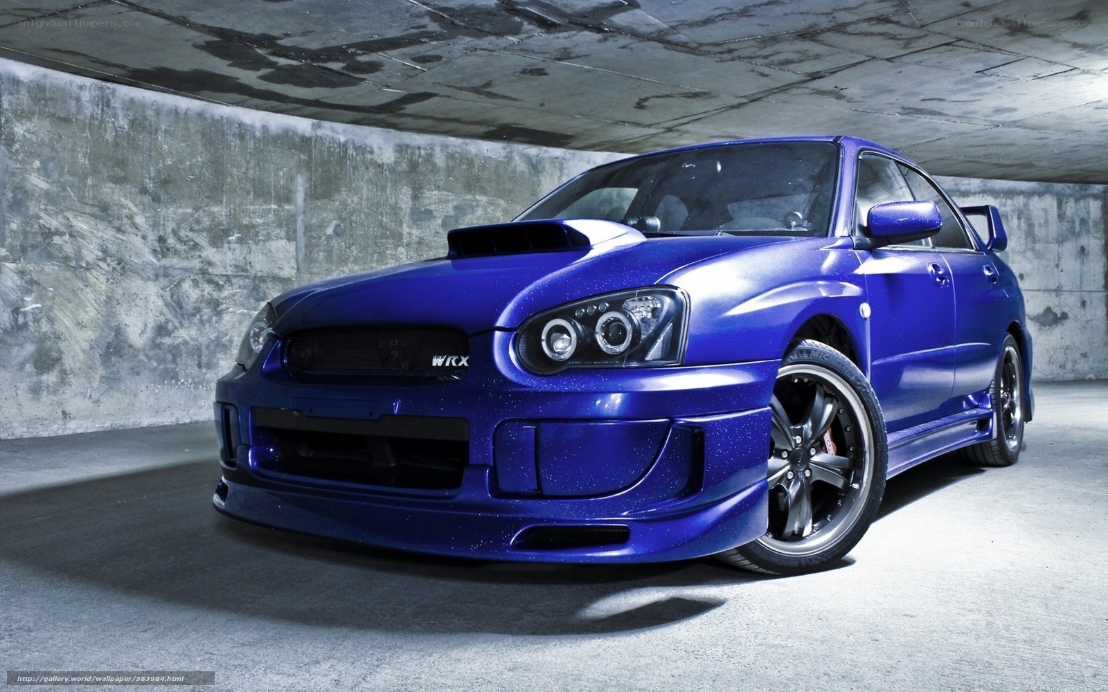 Blue Subaru WRX in garage