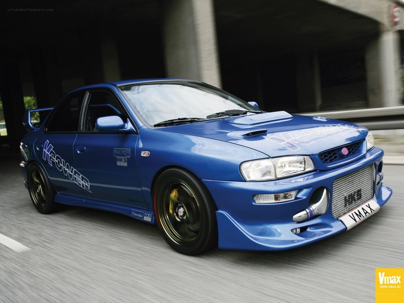 blue subaru wrx in motion