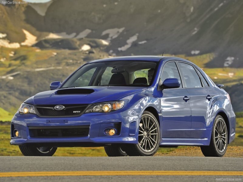 blue subaru wrx on mountain road