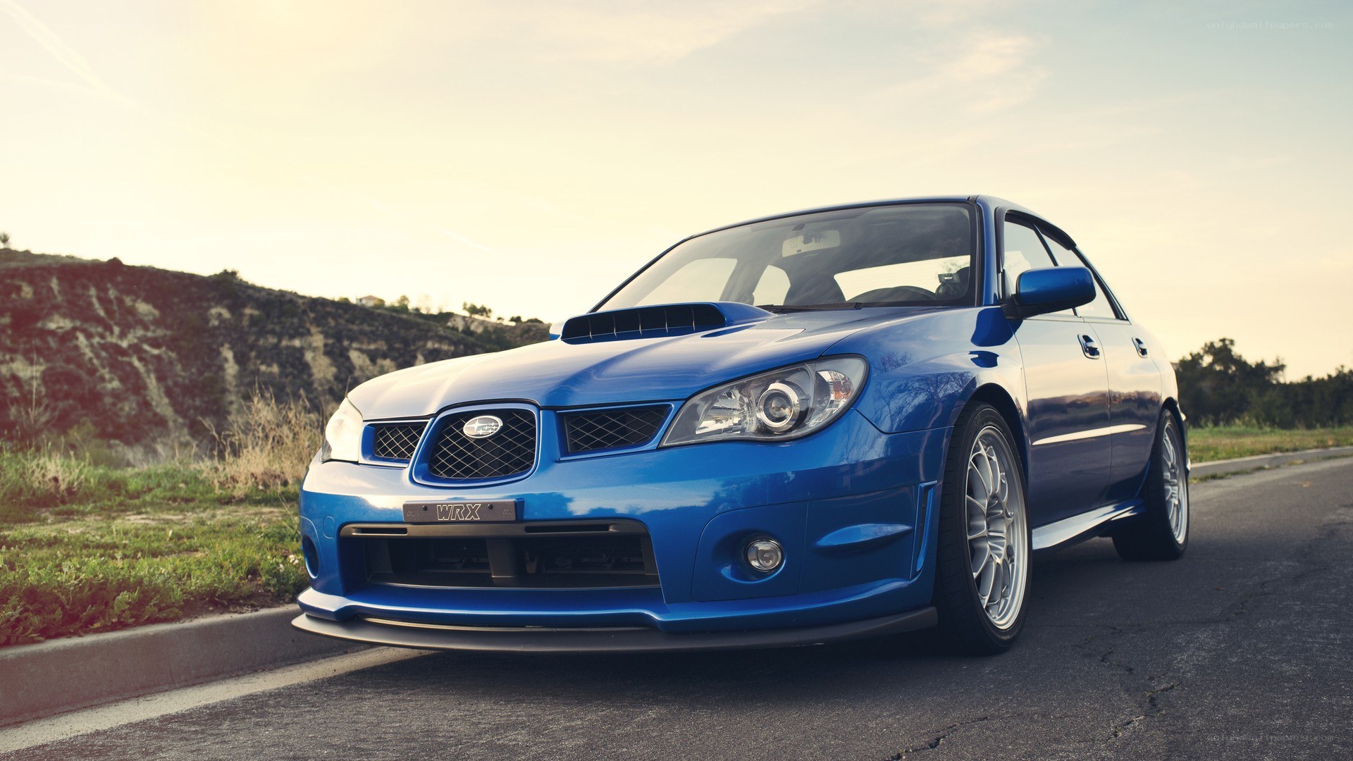 blue subaru wrx on road