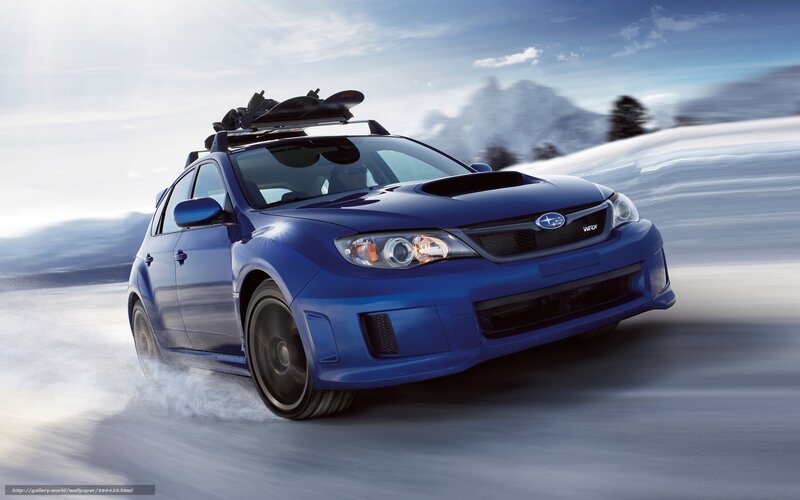 blue subaru wrx on snowy road