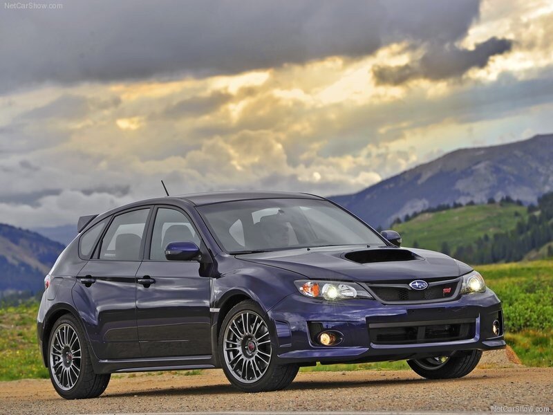 Blue Subaru WRX parked in mountains