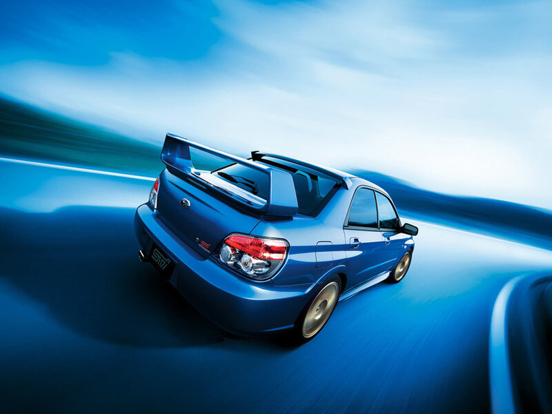 blue subaru wrx sti in motion