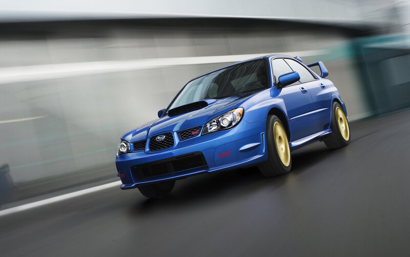 blue subaru wrx sti in motion