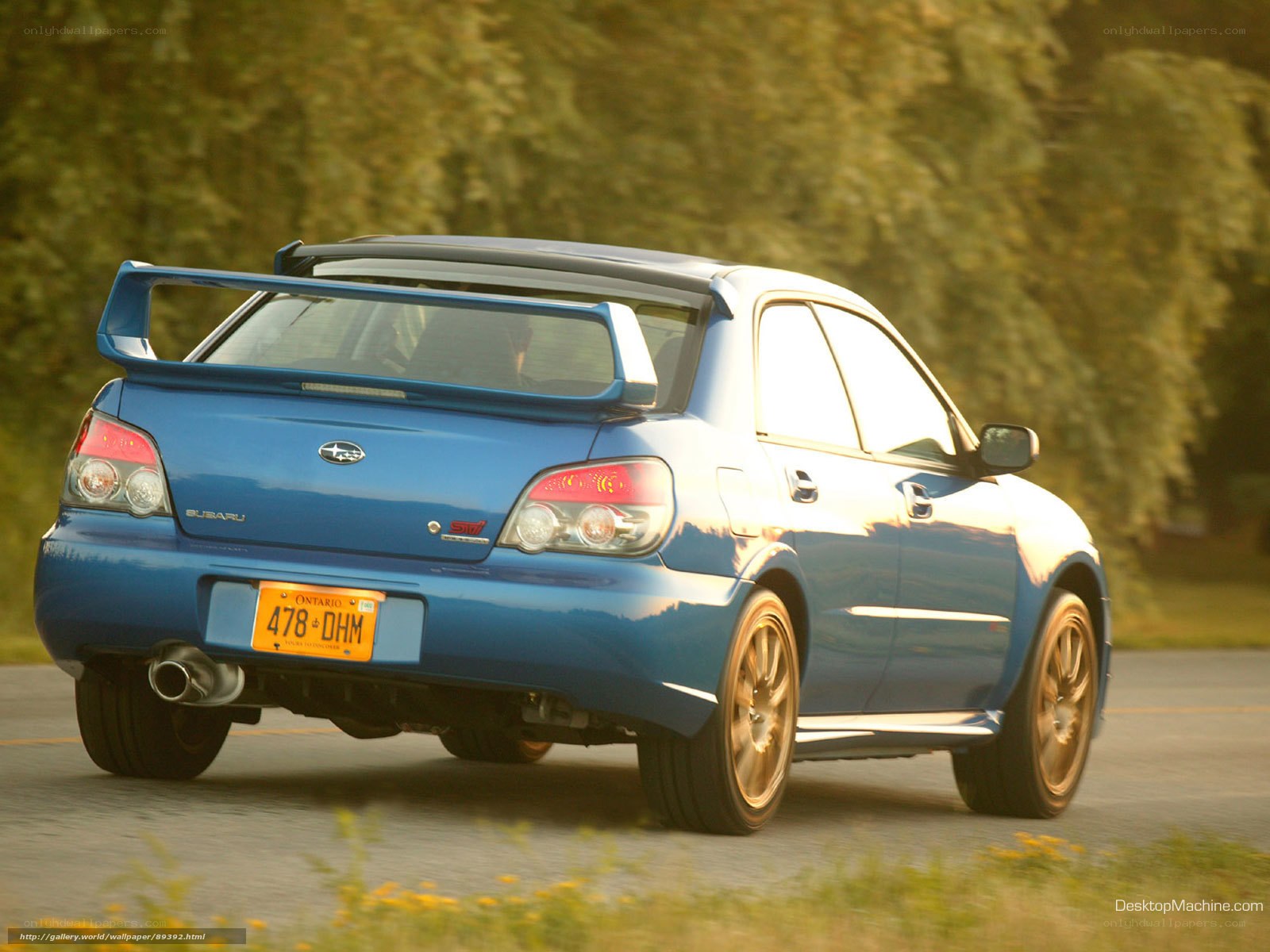 blue subaru wrx sti in motion