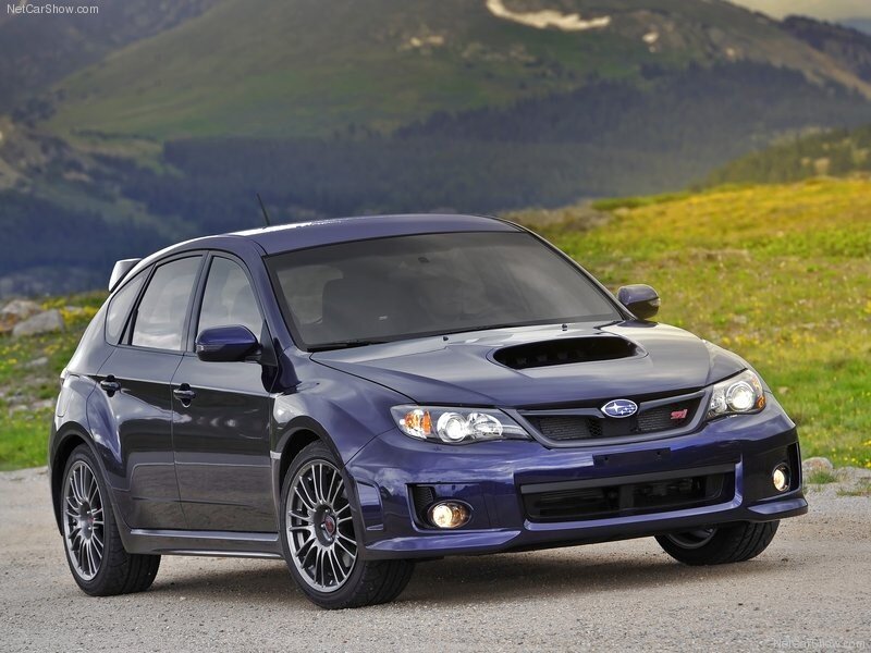 blue subaru wrx sti on mountain road