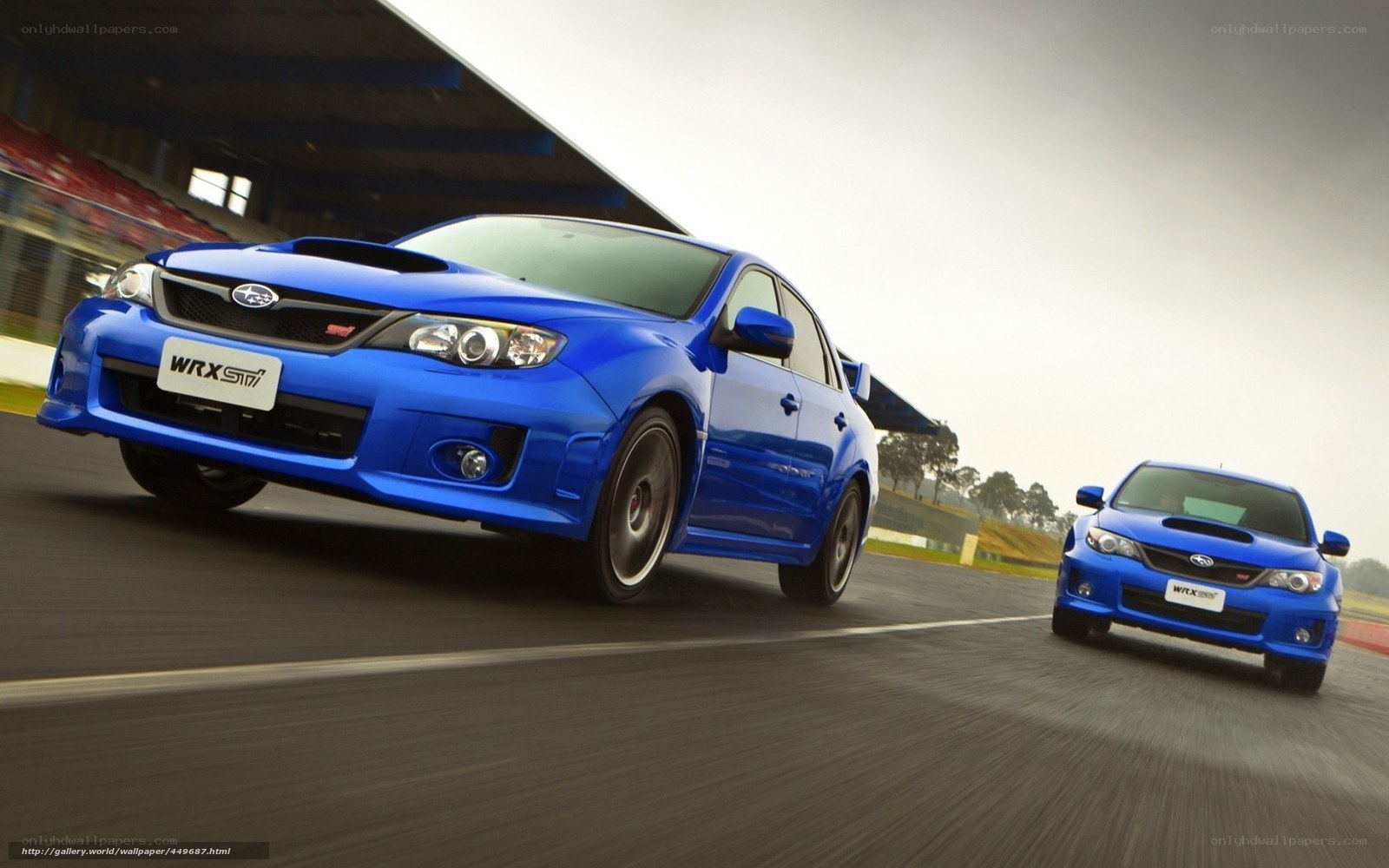 Blue Subaru WRX STI on racetrack