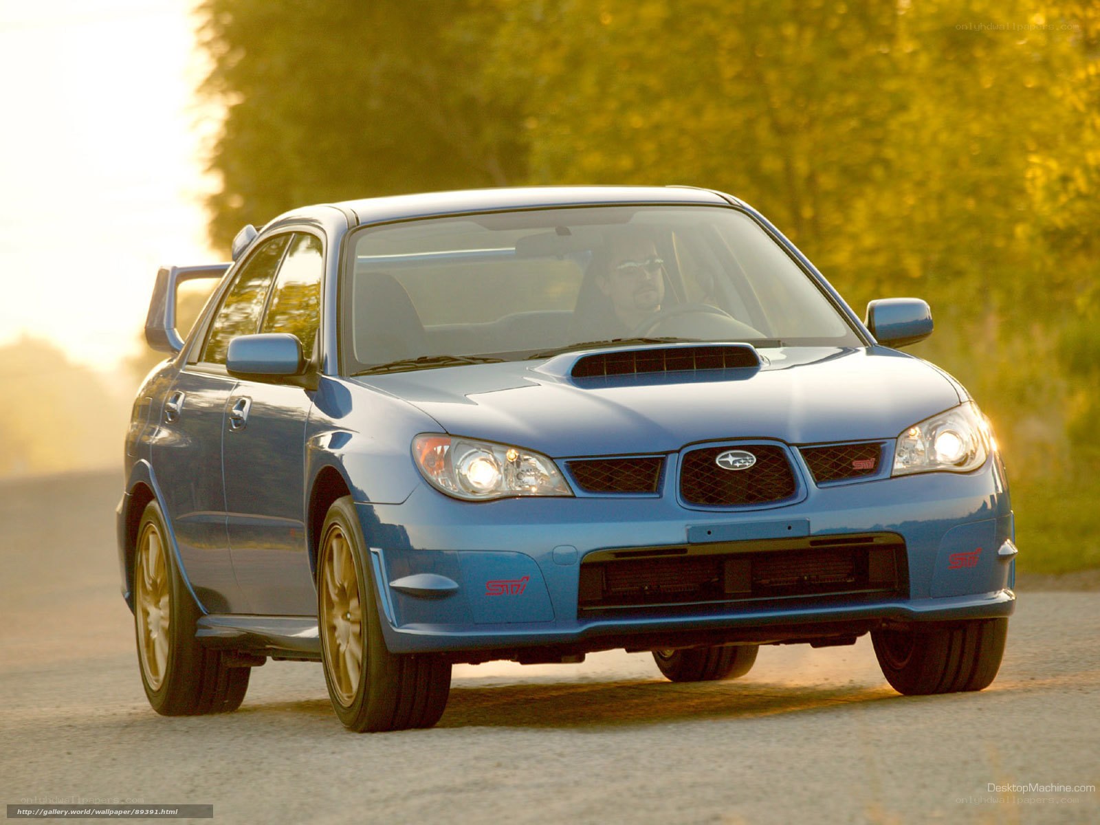 blue subaru wrx sti on road