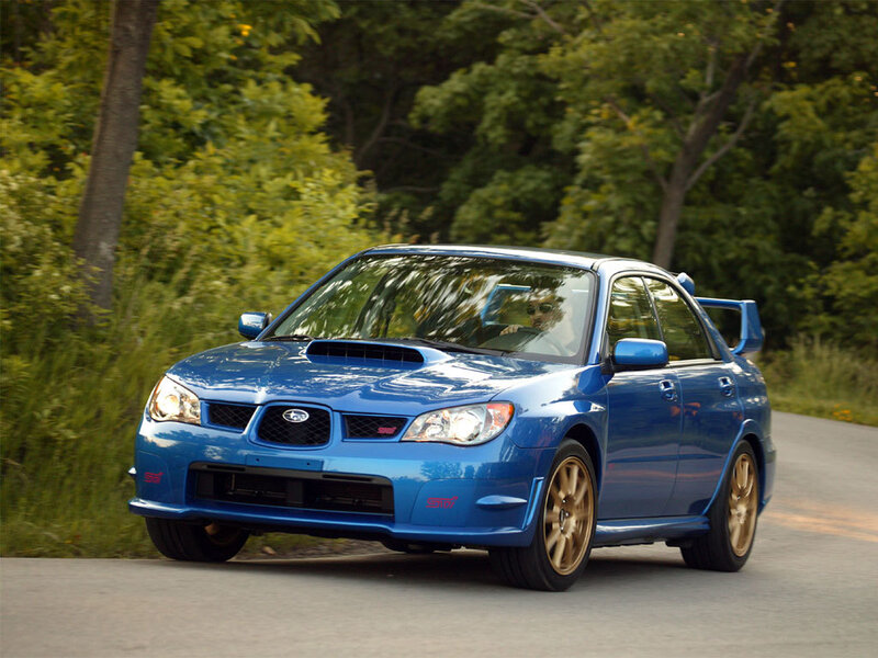 blue subaru wrx sti on road