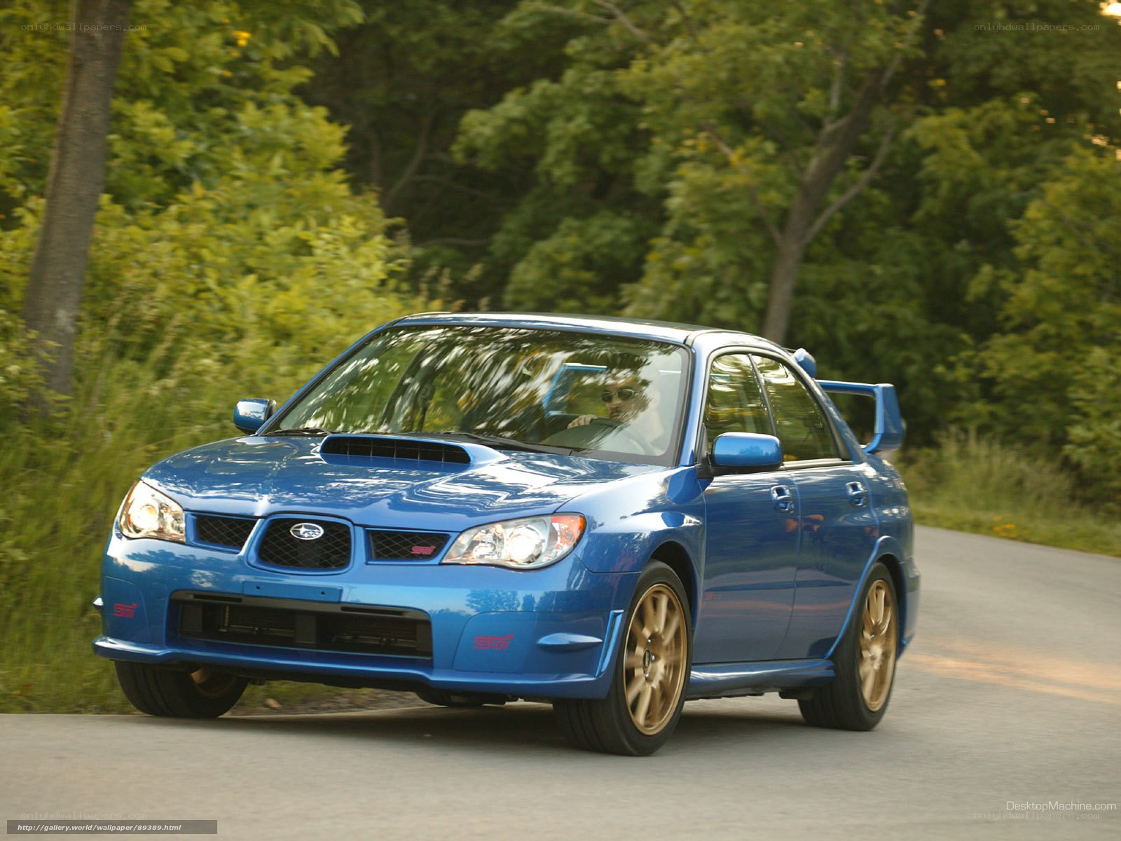 blue subaru wrx sti on road
