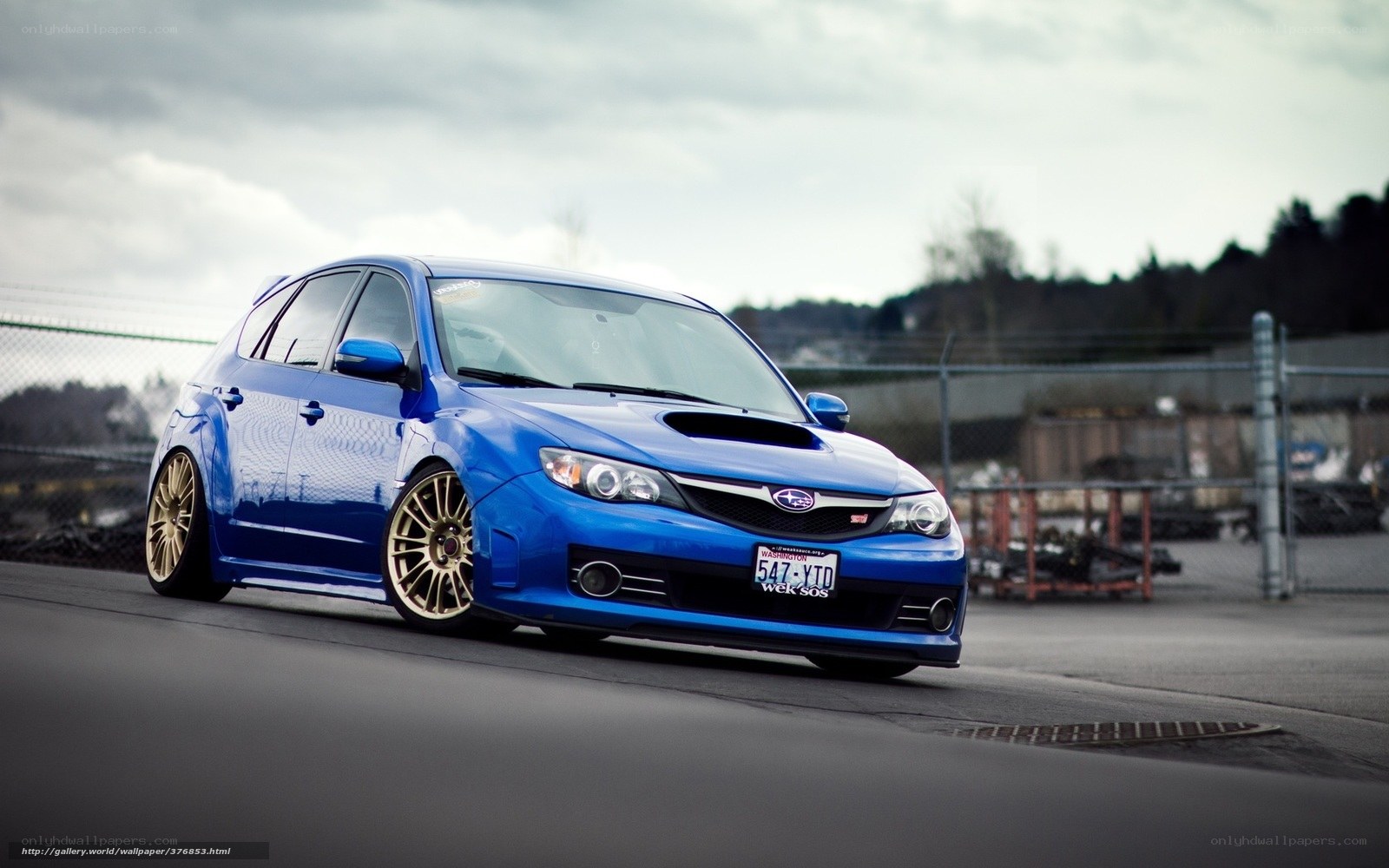 blue subaru wrx sti on track