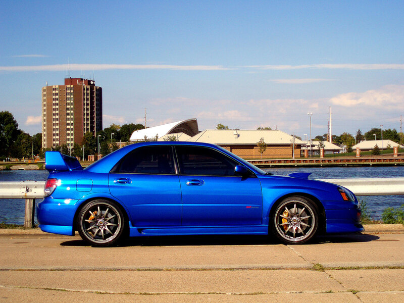 blue subaru wrx sti on waterfront