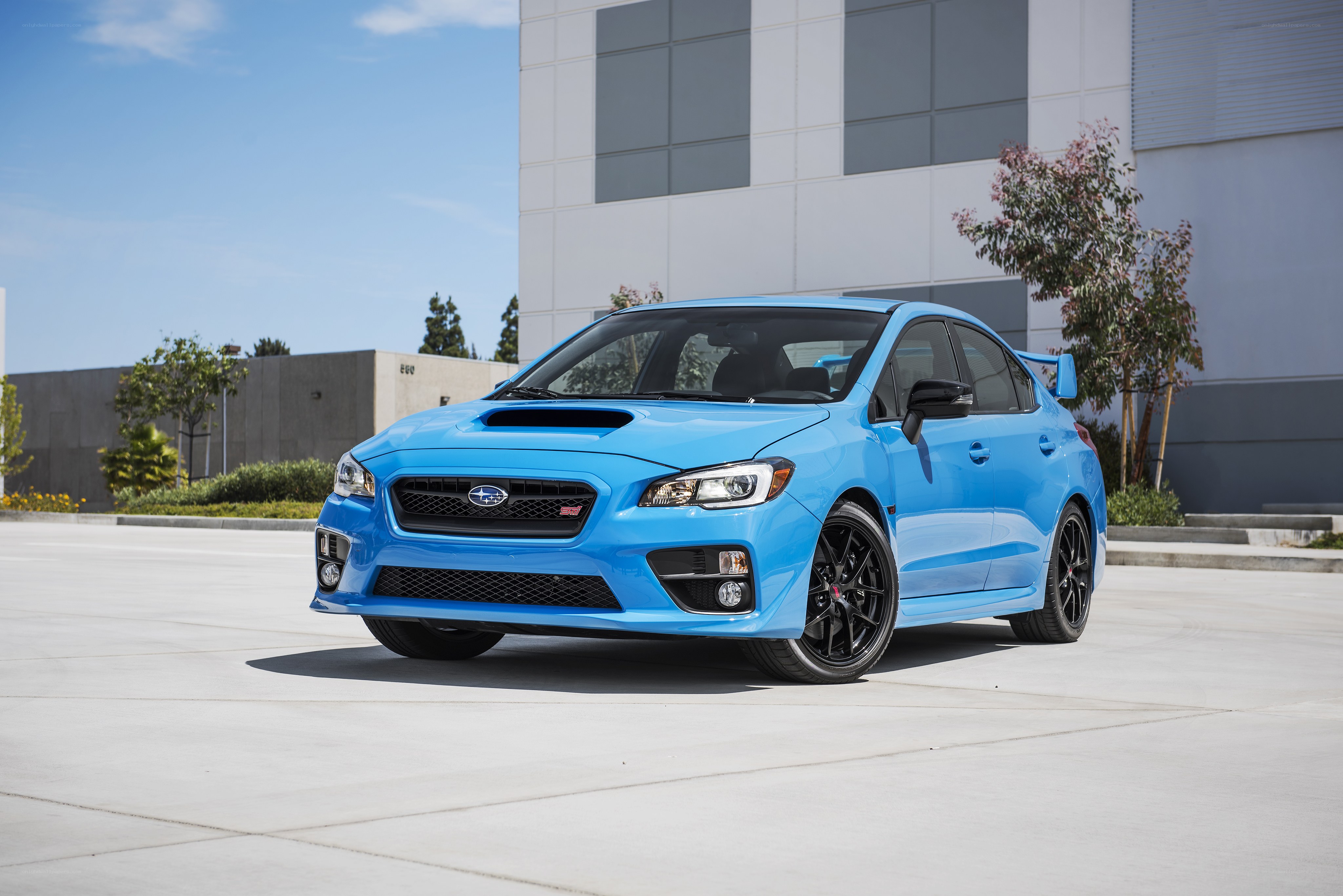 Blue Subaru WRX STI parked outside
