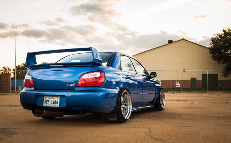blue subaru wrx sti with rear wing