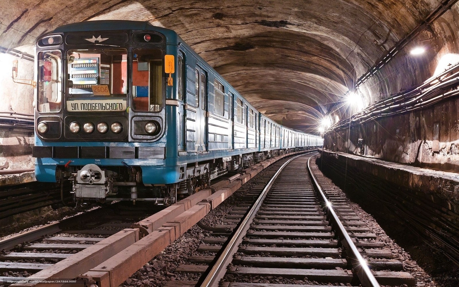Blue subway train in tunnel