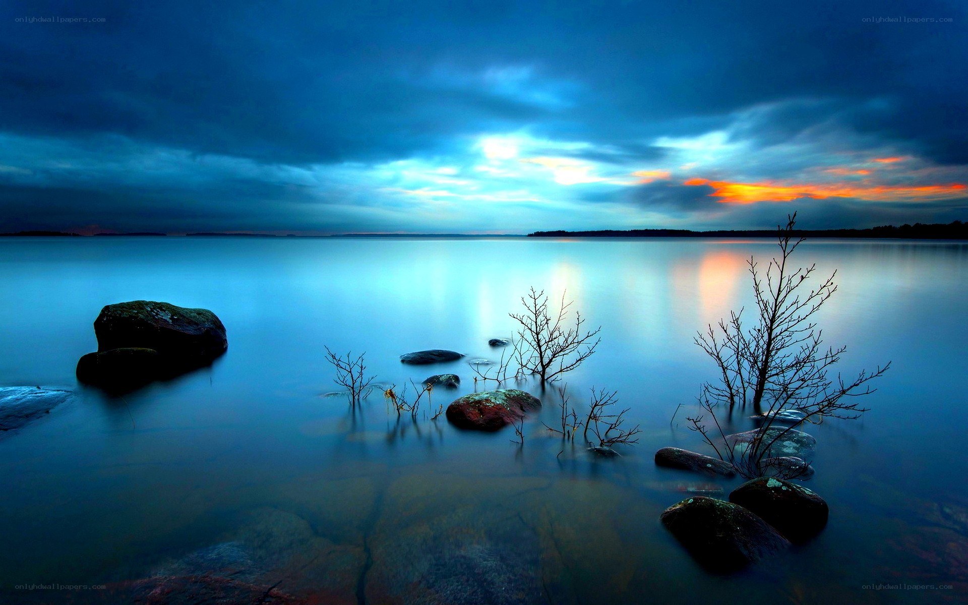 Blue sunset over calm lake