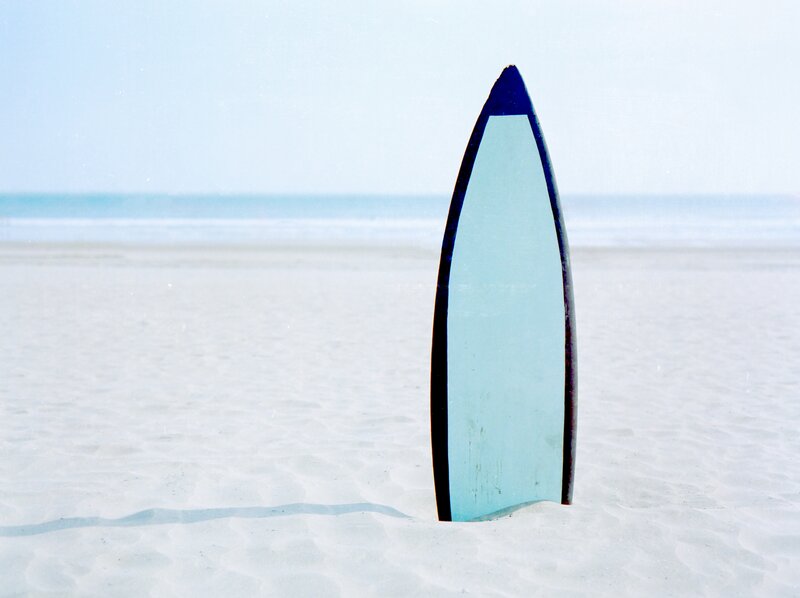 Blue Surfboard on Beach