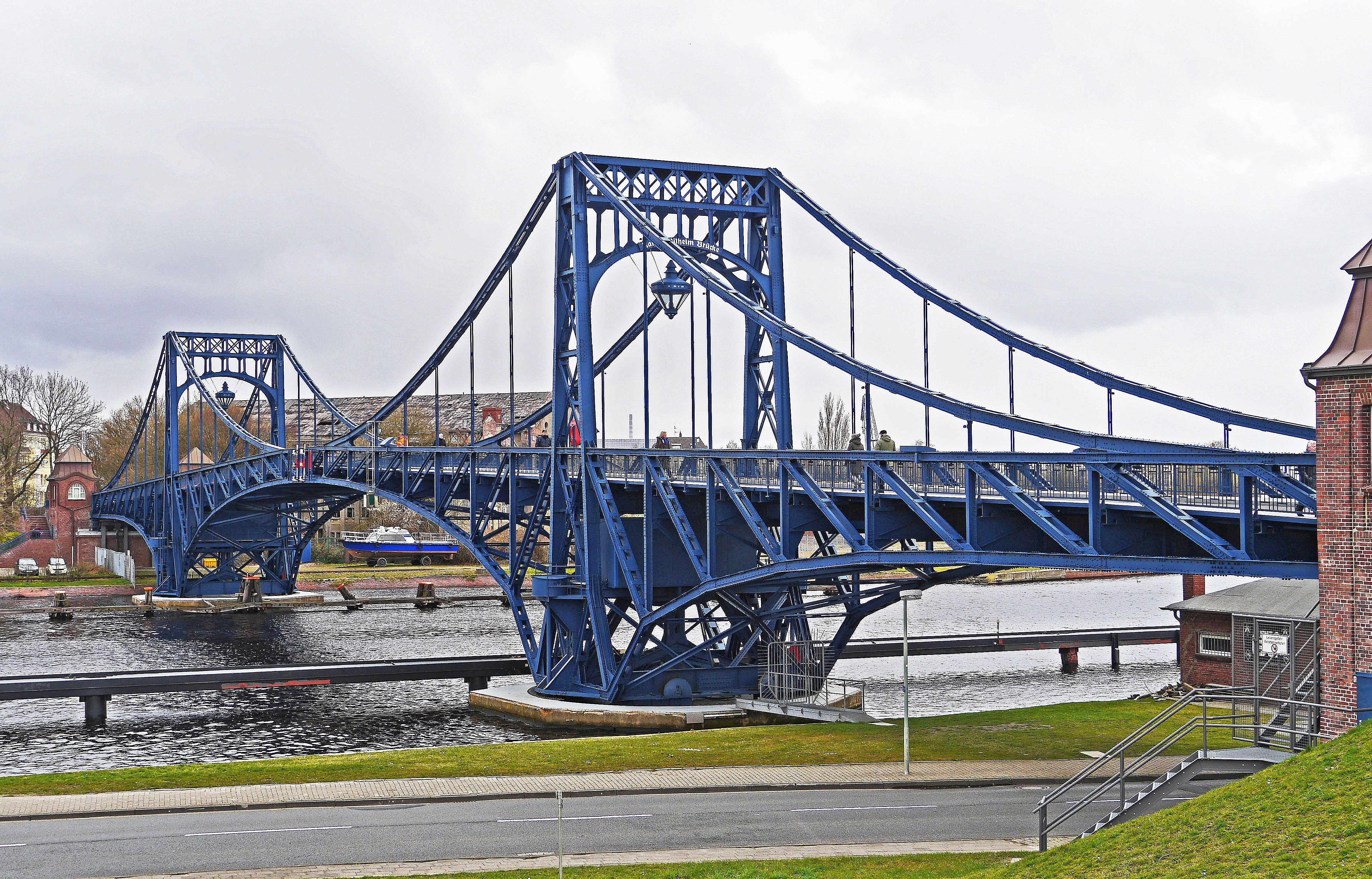 blue suspension bridge over river