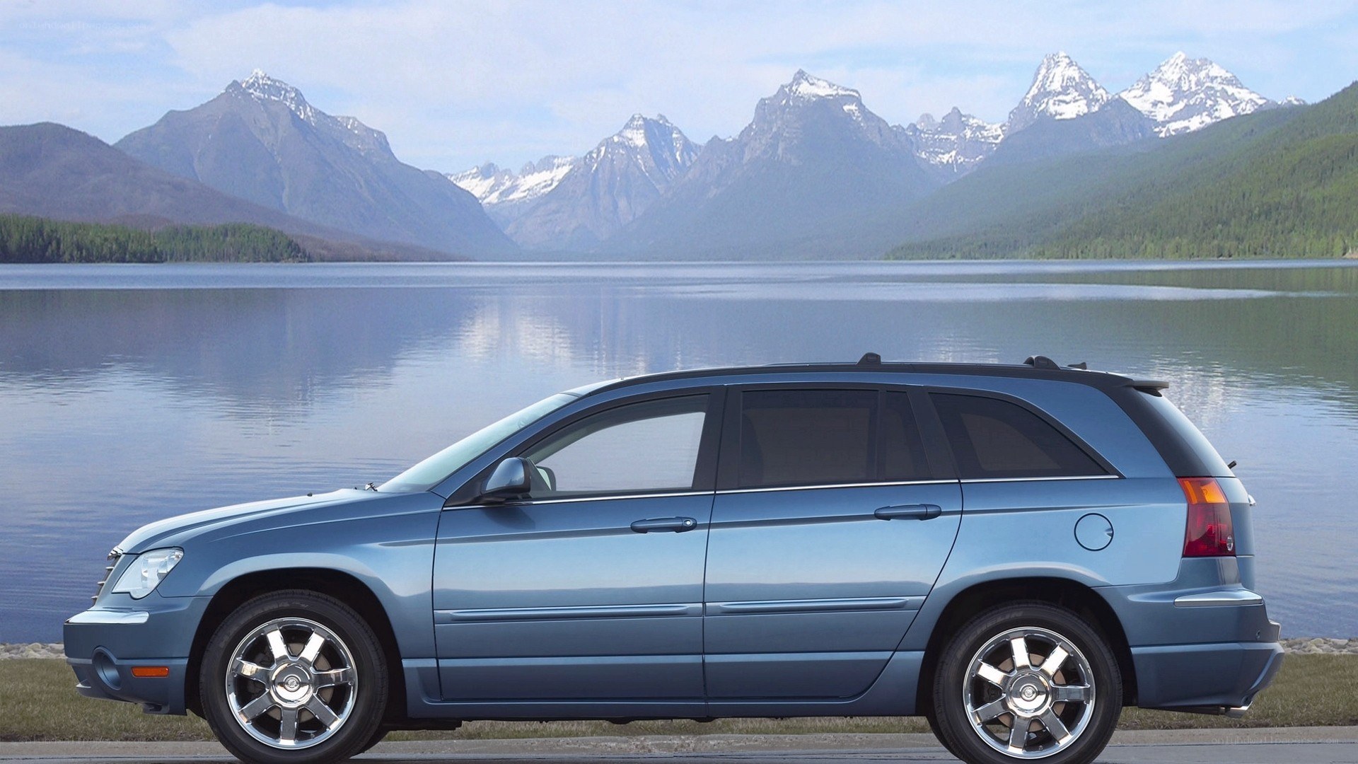Blue SUV by a lake