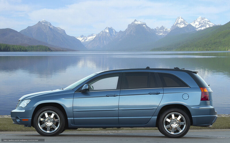 Blue SUV by a lake