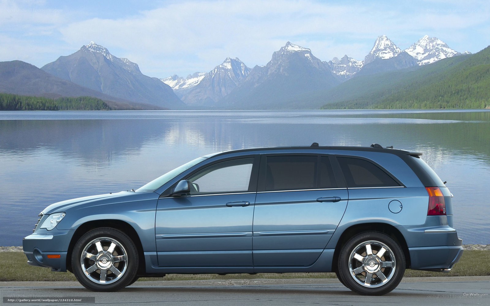 Blue SUV by a lake