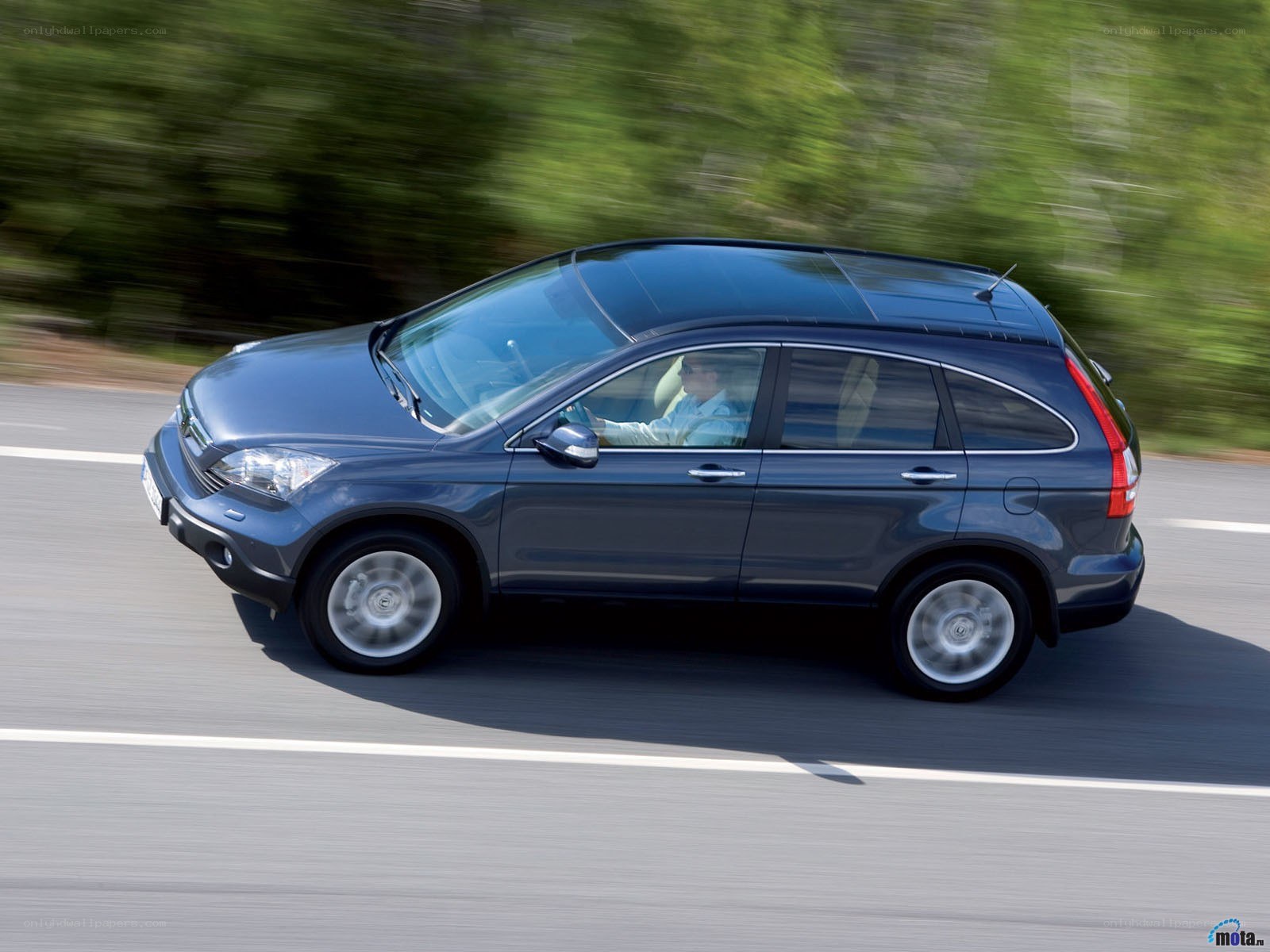 blue suv driving on road