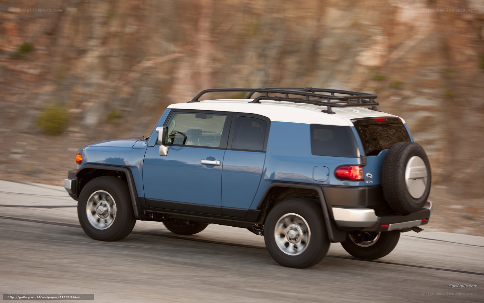 blue suv driving on road