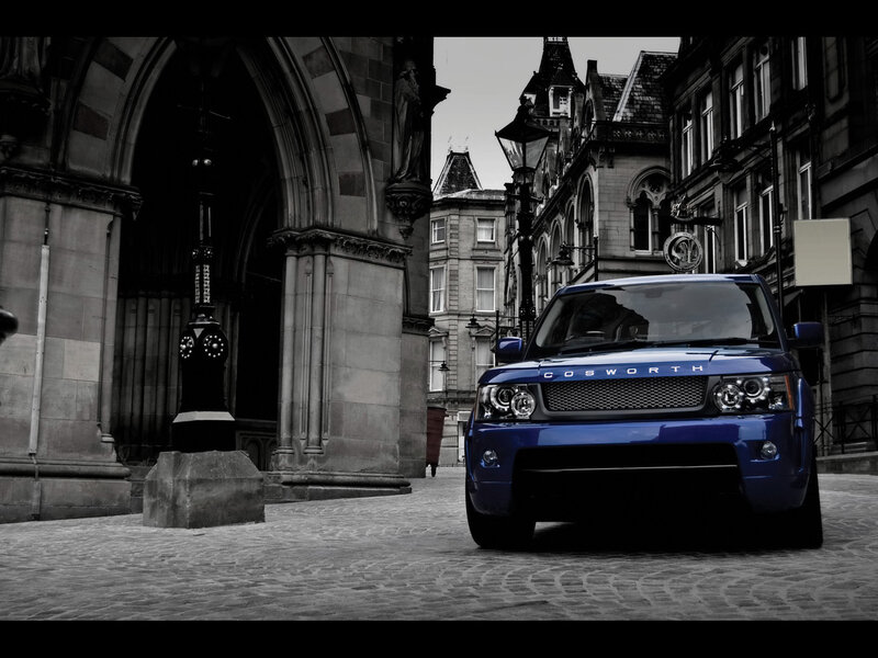 Blue SUV in historic city square