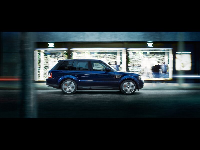 blue suv in motion at night