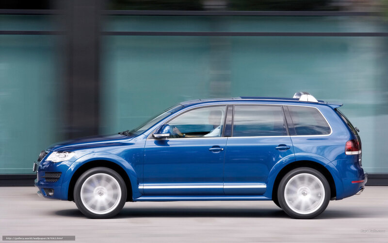 blue suv in motion