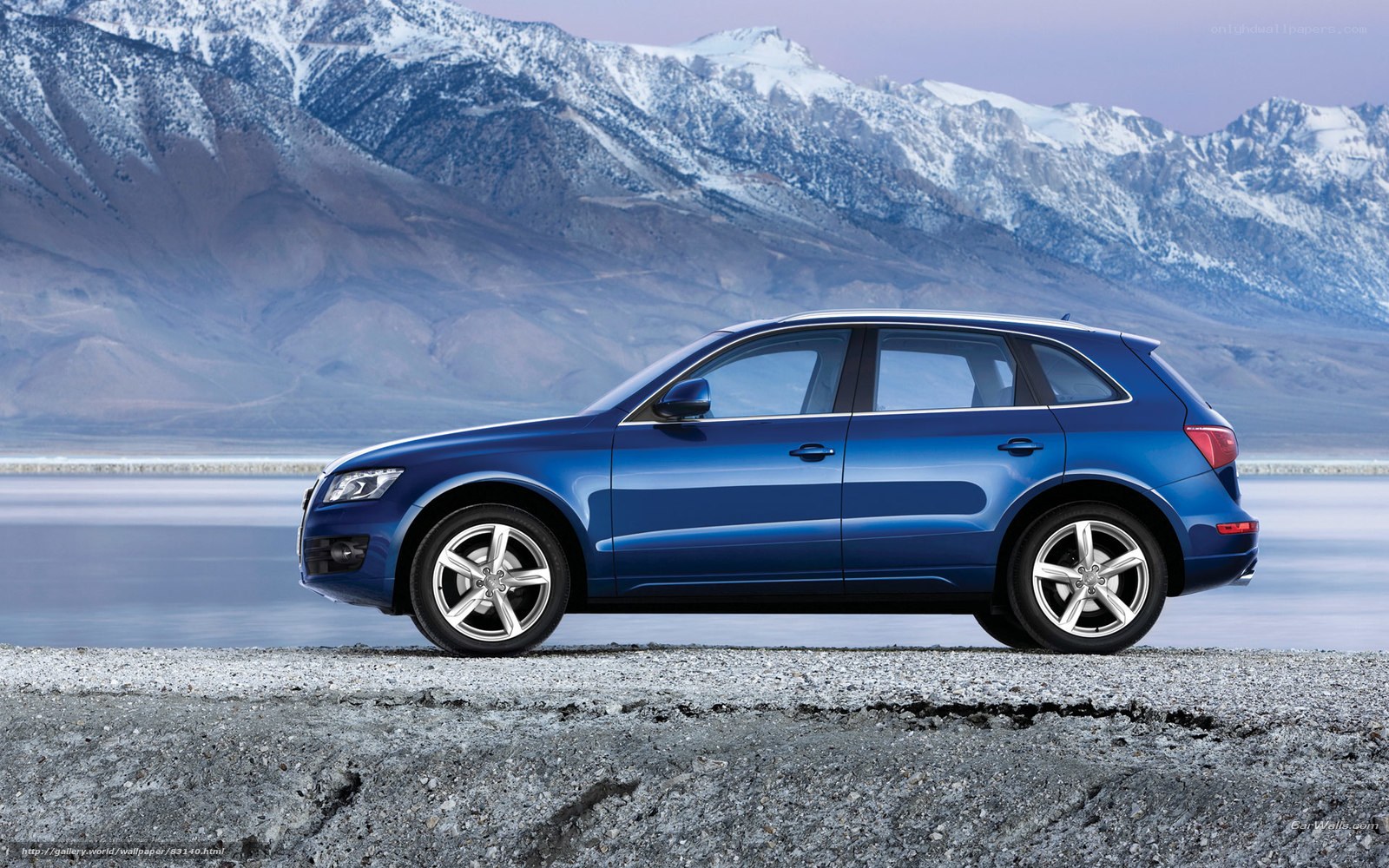 Blue SUV in mountain landscape