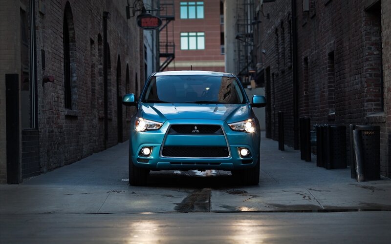 Blue SUV in urban alley