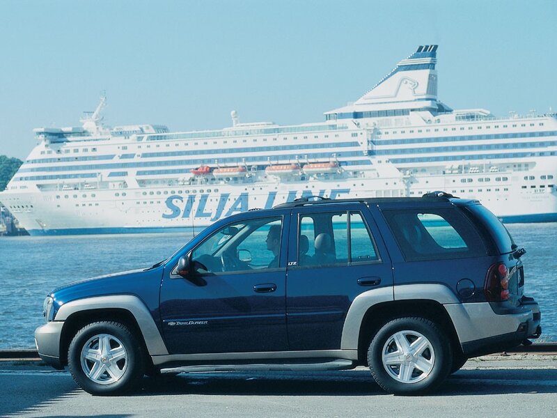 Blue SUV near cruise ship