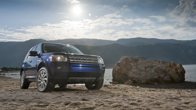 Blue SUV on a beach